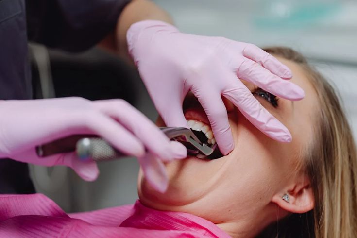 Tooth extraction treatment by experienced dentist at dental clinic